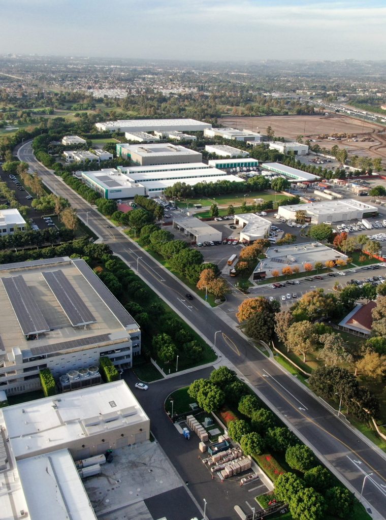 aerial-view-business-finance-district-with-new-office-building-surrounded-by-parking-road